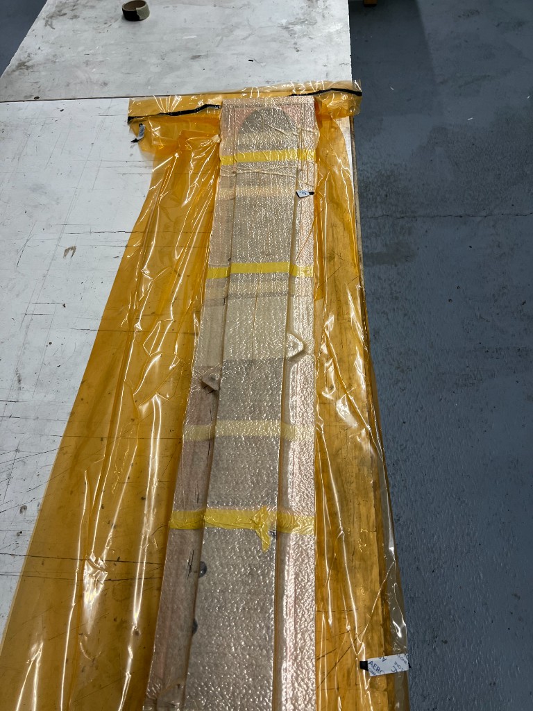 Peak2002 ski layup compressed in the mould to cure
