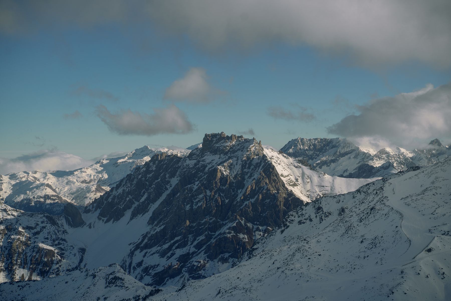 Dramatic snowy aiguille in winter light